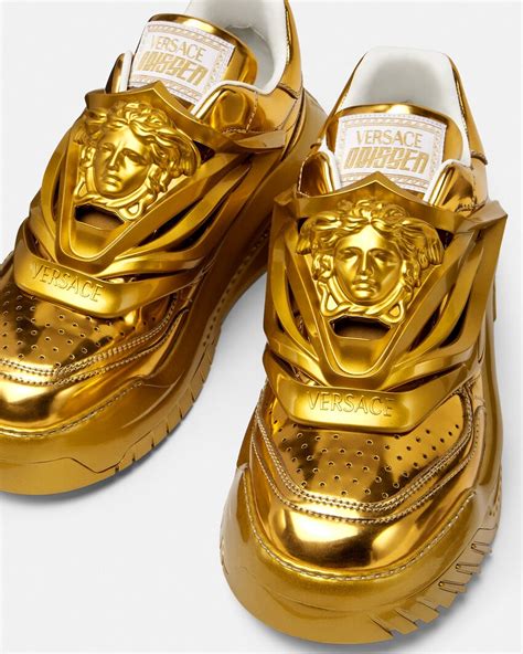 versace gold shoe|Gold Versace sneakers.